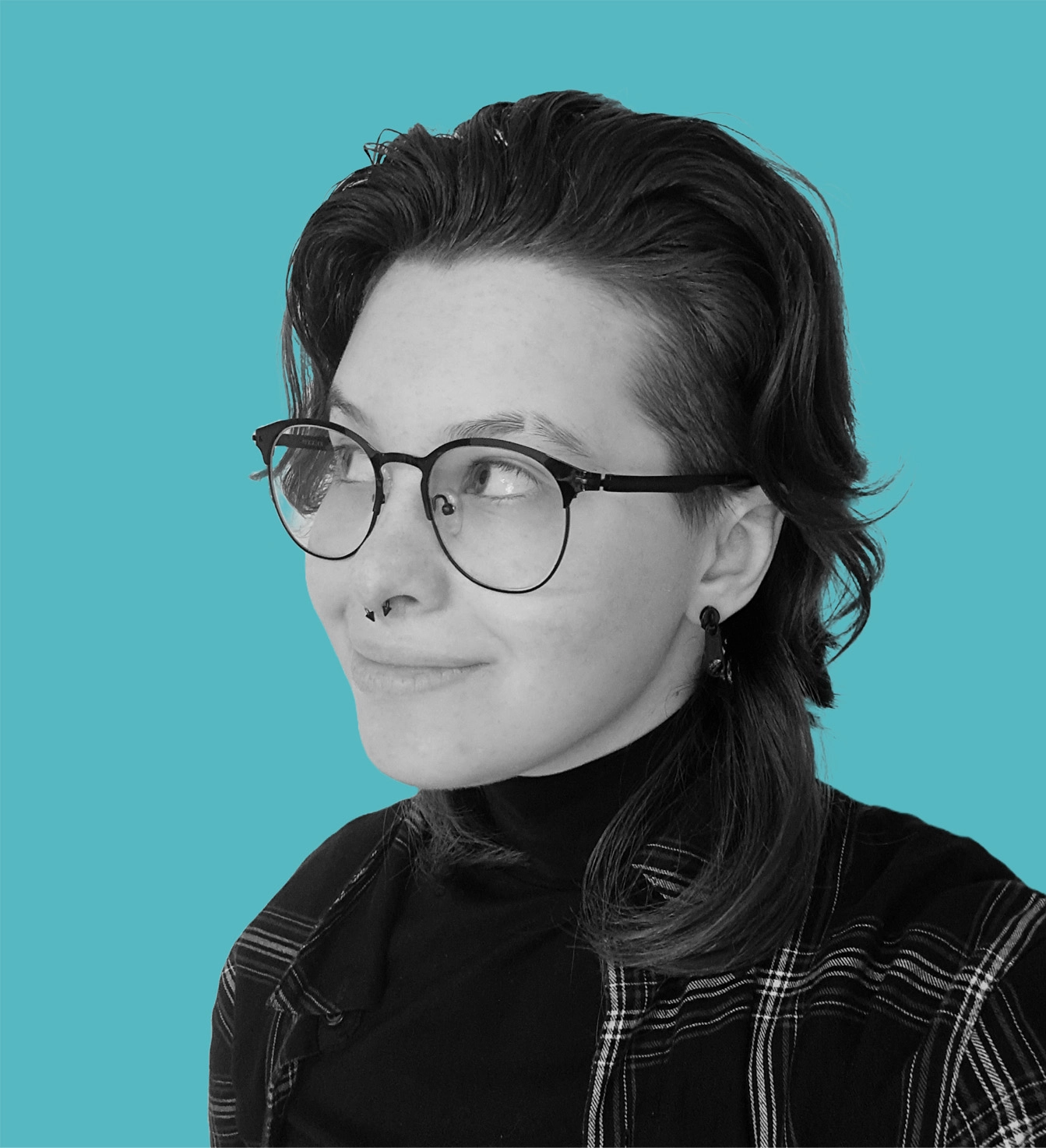 Monochrome photo of Nika Korez from the neck up on a cyan background